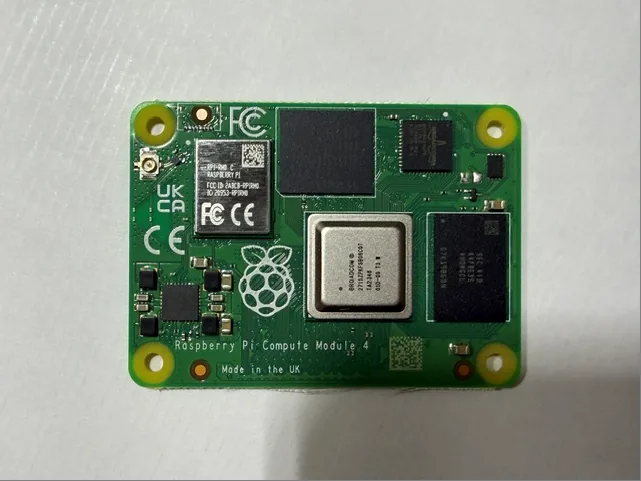Top side of a Raspberry Pi CM4101008 Compute Module 4 showing the Broadcom BCM2711 processor, eMMC and wireless module